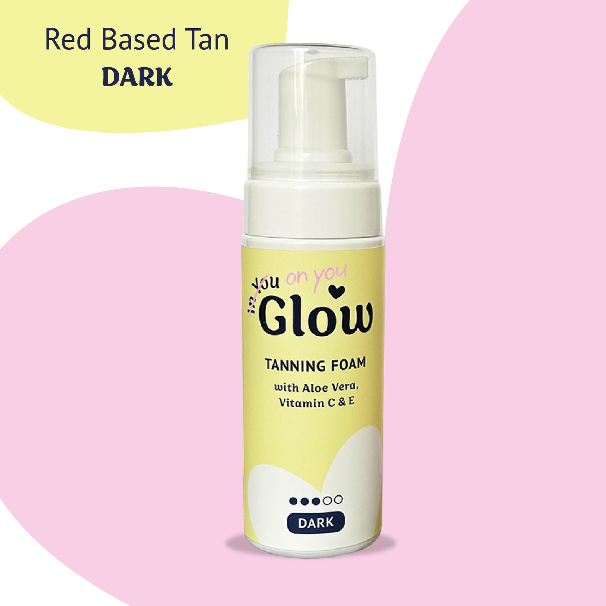 Tanning foam bottle with a yellow label on a pink background